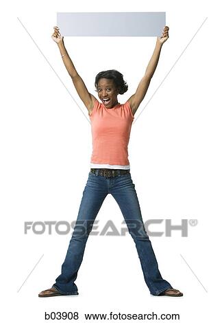 Woman standing with blank sign View Large Photo Image Stock Photo - Woman standing with blank sign. Fotosearch