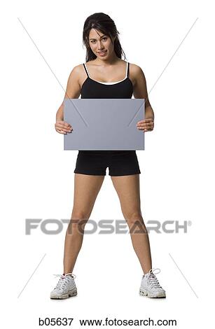 Woman standing with blank sign View Large Photo Image Stock Photo - Woman standing with blank sign. Fotosearch