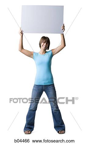 Woman standing with blank sign View Large Photo Image Stock Photograph - Woman standing with blank sign. Fotosearch
