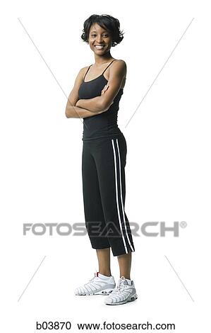 Woman standing with Crossed Arms View Large Photo Image Stock Image - Woman standing with Crossed Arms. Fotosearch