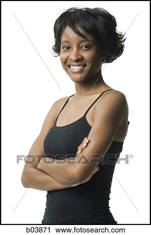 Stock Image - Woman standing with Crossed Arms. Fotosearch