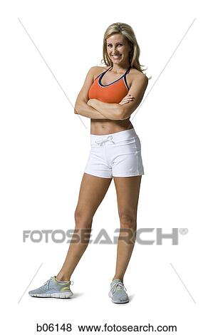 Woman standing with her arms crossed View Large Photo Image Stock Photo - Woman standing with her arms crossed. Fotosearch