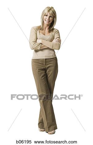Woman standing with her arms crossed View Large Photo Image Stock Photography - Woman standing with her arms crossed. Fotosearch