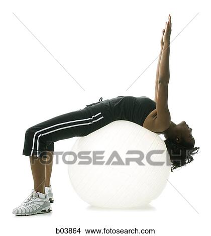 Woman stretching on pilates ball View Large Photo Image Picture - Woman stretching on pilates ball. Fotosearch