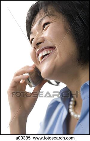 Woman talking on cell phone View Large Photo Image Stock Photography - Woman talking on cell phone. Fotosearch