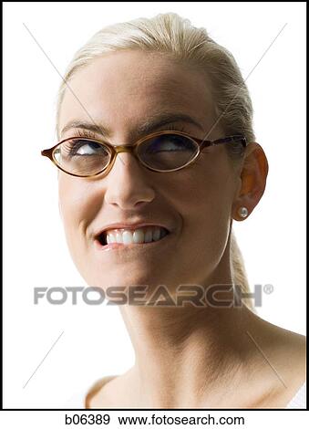 Woman wearing glasses looking up View Large Photo Image Stock Photo - Woman wearing glasses looking up. Fotosearch
