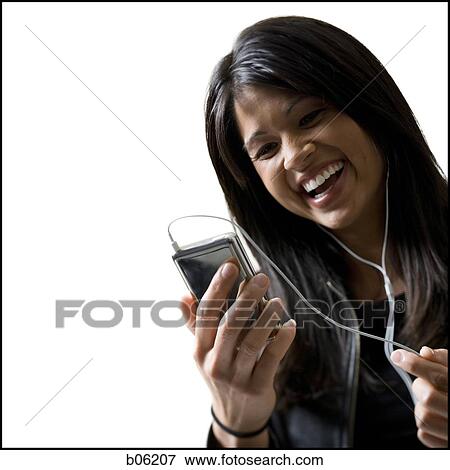 Stock Photo - Woman with an MP3 player. Fotosearch