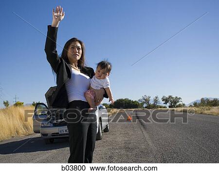 Woman with baby and car View Large Photo Image Stock Image - Woman with baby and car. Fotosearch
