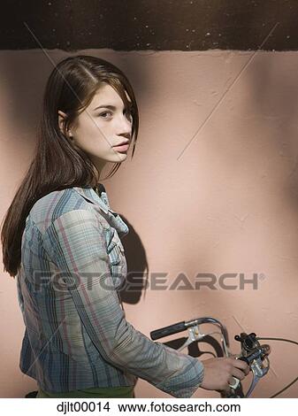 Woman with bicycle View Large Photo Image Picture - Woman with bicycle. Fotosearch