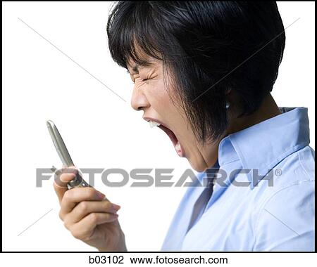 Woman with cell phone shouting View Large Photo Image Stock Image - Woman with cell phone shouting. Fotosearch