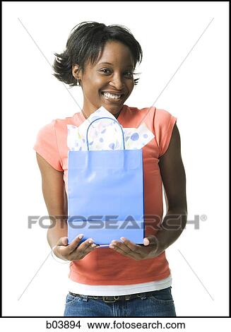 Picture - Woman with gift bag. Fotosearch