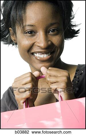 Woman with gift bag View Large Photo Image Stock Image - Woman with gift bag. Fotosearch