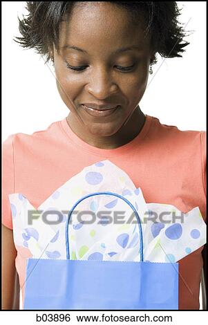 Woman with gift bag View Large Photo Image Stock Photograph - Woman with gift bag. Fotosearch