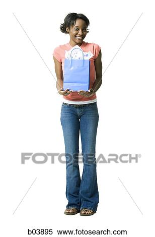 Woman with gift bag View Large Photo Image Stock Photography - Woman with gift bag. Fotosearch