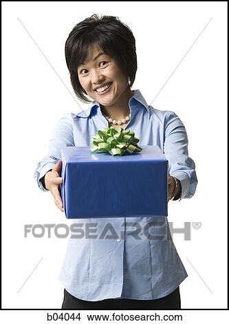Woman with gift box View Large Photo Image Picture - Woman with gift box. Fotosearch