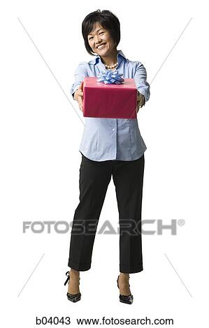 Woman with gift box View Large Photo Image Stock Image - Woman with gift box. Fotosearch