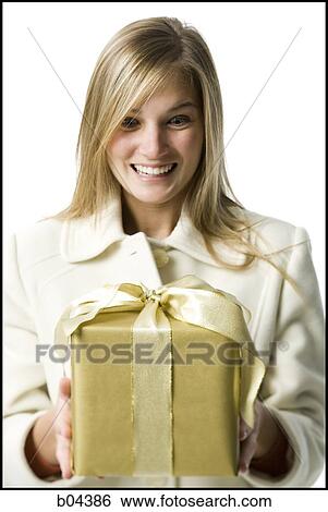 Stock Photograph - Woman with gift box. Fotosearch