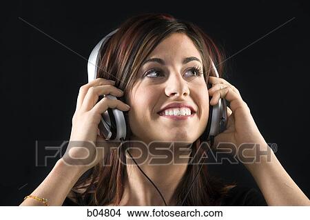 Picture - Woman with headphones smiling. Fotosearch