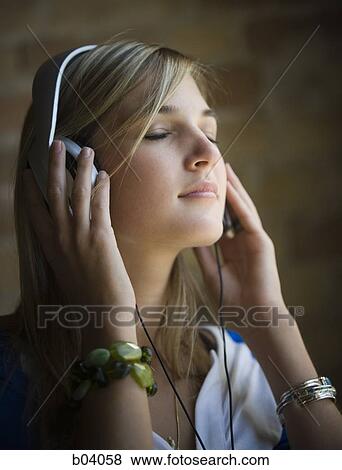 Woman with headphones View Large Photo Image Stock Photo - Woman with headphones. Fotosearch