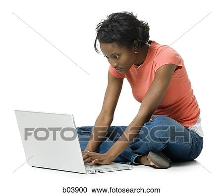 Woman with laptop sitting cross legged View Large Photo Image Stock Image - Woman with laptop sitting cross legged. Fotosearch