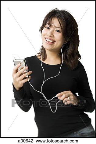 Woman with mp3 player smiling View Large Photo Image Stock Image - Woman with mp3 player smiling. Fotosearch
