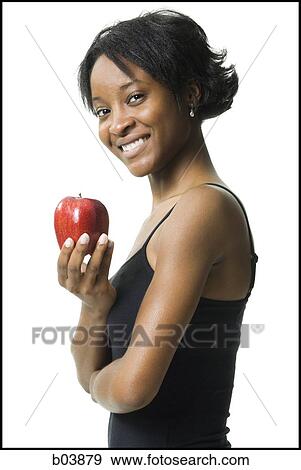 Woman with red apple View Large Photo Image Stock Photo - Woman with red apple. Fotosearch