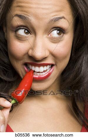 Woman with red lipstick eating red pepper View Large Photo Image Stock Photograph - Woman with red lipstick eating red pepper. Fotosearch