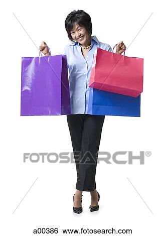 Woman with shopping bags View Large Photo Image Stock Photograph - Woman with shopping bags. Fotosearch