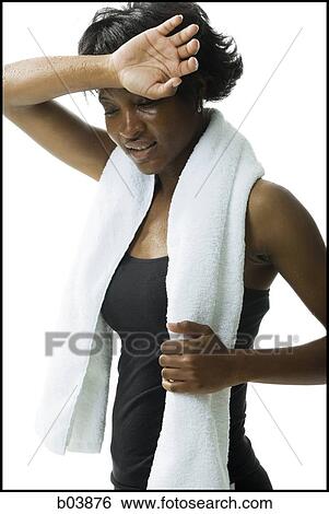 Woman with towel perspiring View Large Photo Image Stock Photograph - Woman with towel perspiring. Fotosearch