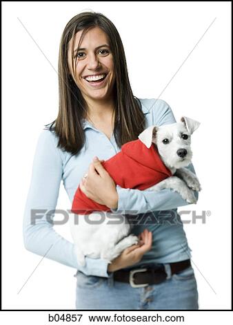 Woman with white dog in hooded sweatshirt View Large Photo Image Stock Photo - Woman with white dog in hooded sweatshirt. Fotosearch