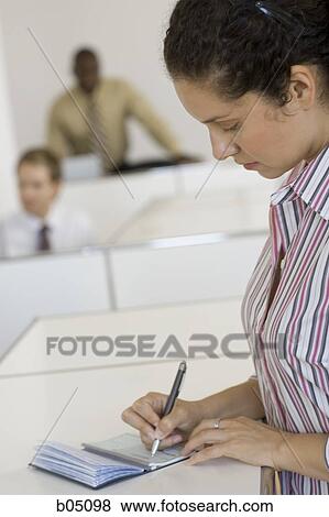 Stock Photo - Woman writing check. Fotosearch