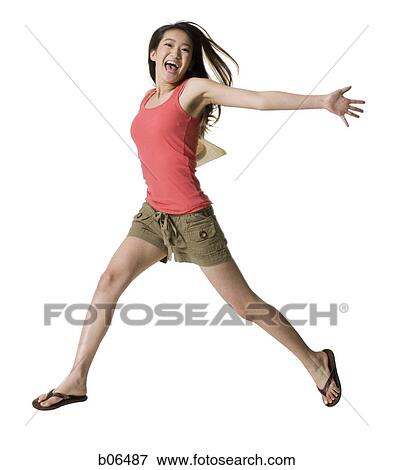 Stock Photo - Young adult jumping. Fotosearch