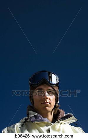 Young adult man outside in the snow View Large Photo Image Stock Photograph - Young adult man outside in the snow. Fotosearch