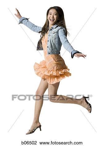 Young adult woman jumping View Large Photo Image Stock Image - Young adult woman jumping. Fotosearch