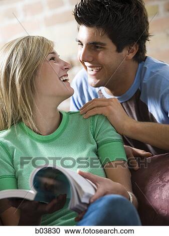 Stock Image - Young couple laughing. Fotosearch