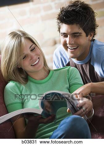 Young couple laughing View Large Photo Image Stock Image - Young couple laughing. Fotosearch