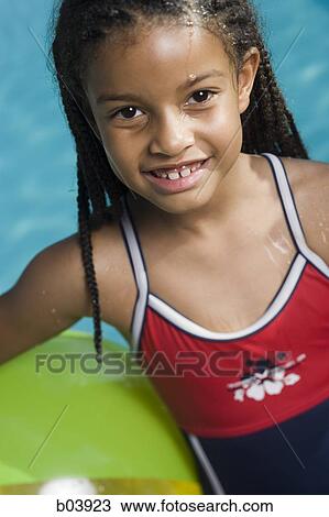 Young girl in bathing suit smiling View Large Photo Image Stock Image - Young girl in bathing suit smiling. Fotosearch