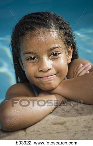 Young girl in water smiling View Large Photo Image Stock Image - Young girl in water smiling. Fotosearch