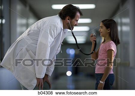 Stock Photo - Young girl playing with male doctor's stethoscope. Fotosearch