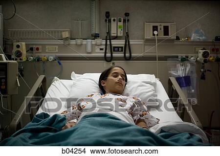 Young girl sleeping in hospital bed View Large Photo Image Picture - Young girl sleeping in hospital bed. Fotosearch