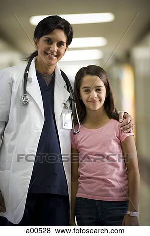 Stock Photo - Young girl with female doctor. Fotosearch