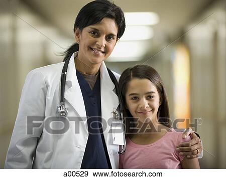 Young girl with female doctor View Large Photo Image Stock Photo - Young girl with female doctor. Fotosearch