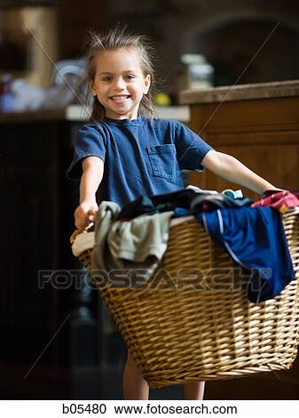 Young girl with laundry basket View Large Photo Image Stock Image - Young girl with laundry basket. Fotosearch