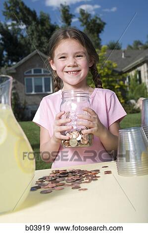 Young girl with lemonade stand and money jar View Large Photo Image Stock Photo - Young girl with lemonade stand and money jar. Fotosearch