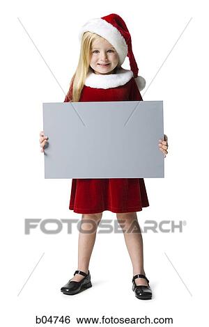 Stock Photograph - Young girl with santa hat holding blank sign. Fotosearch