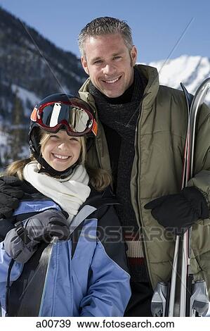 Stock Photo - A father and his daughter outside in the snow. Fotosearch