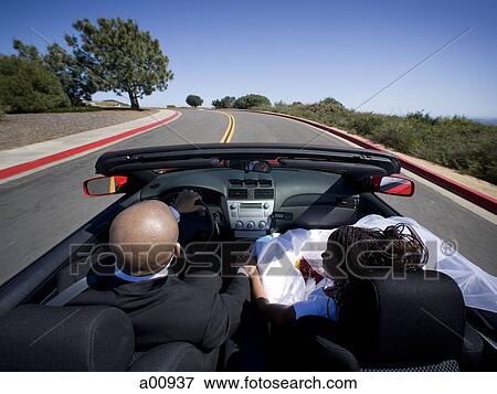African-American newlywed couple in convertible car View Large Photo Image Stock Photo - African-American newlywed couple in convertible car. Fotosearch