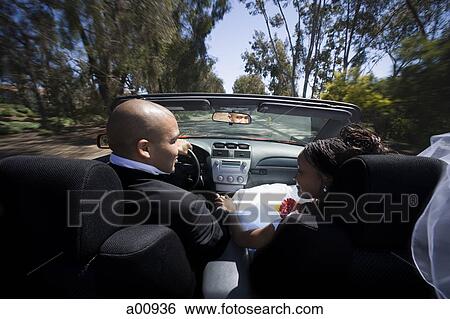 African-American newlywed couple in convertible car View Large Photo Image Stock Photograph - African-American newlywed couple in convertible car. Fotosearch