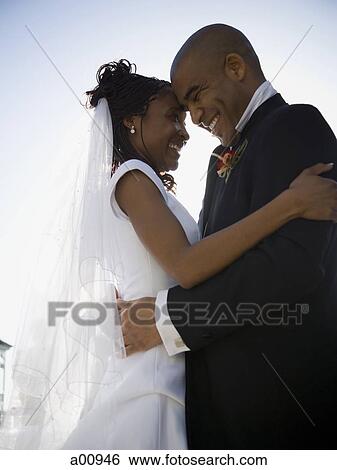Stock Photograph - African-American newlywed couple. Fotosearch