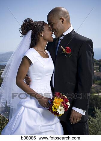 Stock Photograph - African-American newlywed couple. Fotosearch